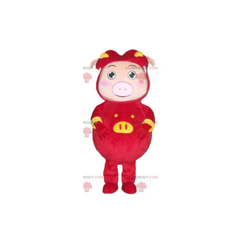 Pink pig mascot dressed in a red and yellow costume -