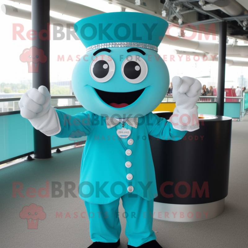 Turquoise Ring Master mascot costume character dressed with a Button-Up Shirt and Bracelets Turquoise Ring Master mascot costume character dressed with a Button-Up Shirt and Bracelets