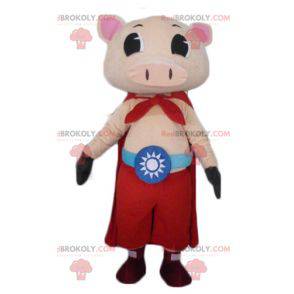 Mascota de cerdo rosa con pantalones y una capa. -