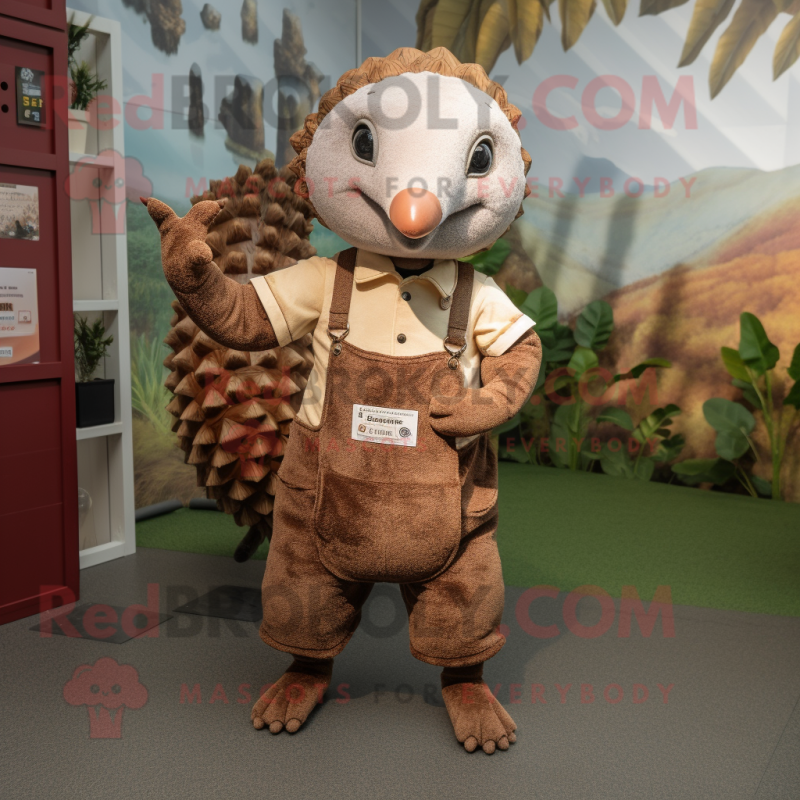 Rust Pangolin mascot costume character dressed with a Dungarees and Keychains