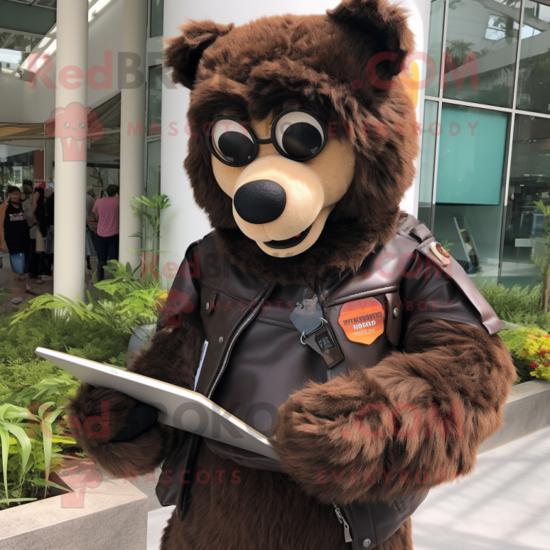 Brown Spectacled Bear mascot costume character dressed with a Moto Jacket and Reading glasses