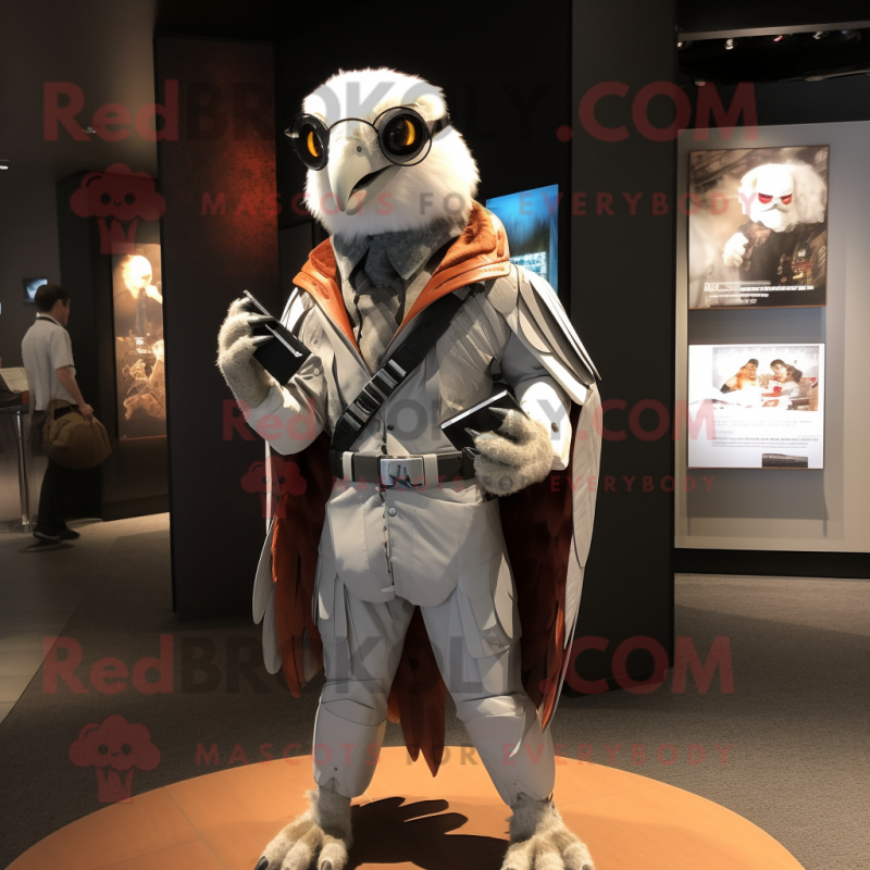 Silver Falcon mascot costume character dressed with a Jacket and Wallets Silver Falcon mascot costume character dressed with a Jacket and Wallets