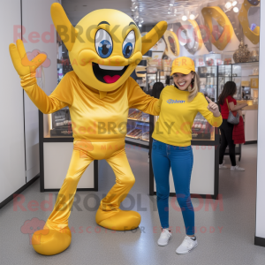 Gold Contortionist mascot costume character dressed with a Mom Jeans and Shoe laces