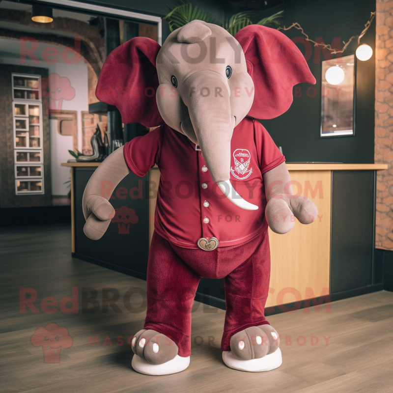 Maroon Elephant mascot costume character dressed with a Polo Tee and Bracelets Maroon Elephant mascot costume character dressed with a Polo Tee and Bracelets