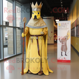 Gold Medieval Knight mascot costume character dressed with a Maxi Dress and Hat pins
