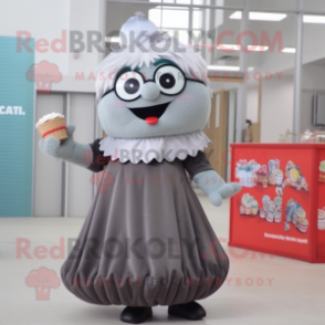 Gray Cupcake mascot costume character dressed with a Maxi Dress and Reading glasses