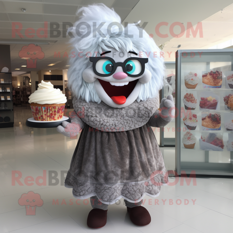 Gray Cupcake mascot costume character dressed with a Maxi Dress and Reading glasses