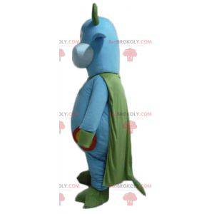 Blue and green cow mascot with a bell around its neck -