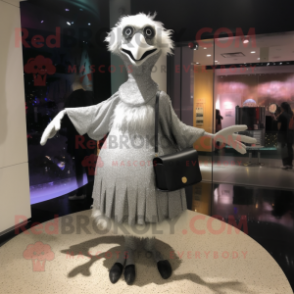 Silver Ostrich mascot costume character dressed with a A-Line Skirt and Messenger bags