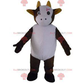 Leuke en ontroerende bruine en witte koe mascotte -