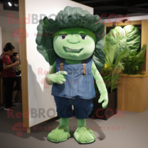 Forest Green Cabbage Leaf mascot costume character dressed with a Denim Shorts and Suspenders