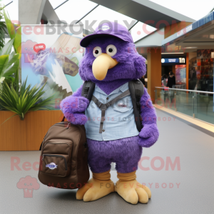 Purple Kiwi mascot costume character dressed with a Jeans and Messenger bags