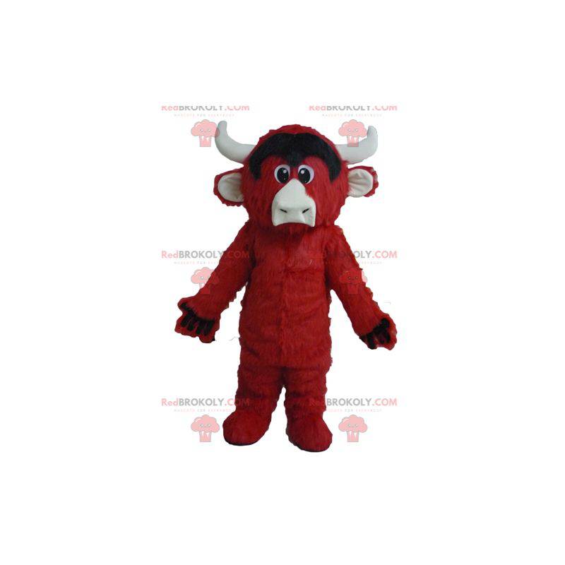 Mascotte de vache rouge noire et blanche toute poilue -