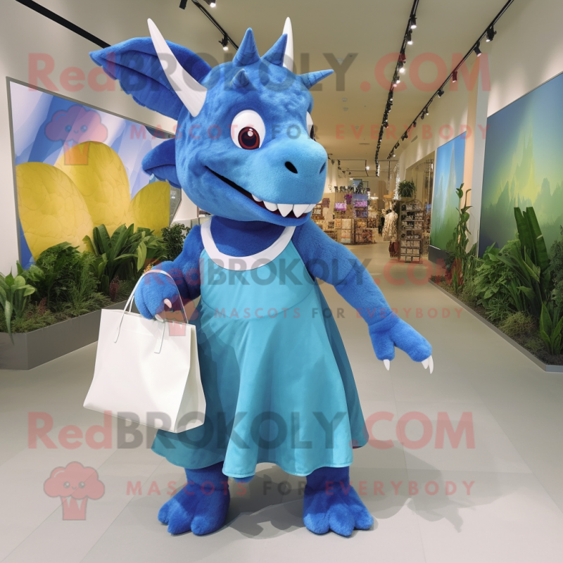 Blue Triceratops mascot costume character dressed with a Maxi Skirt and Tote bags