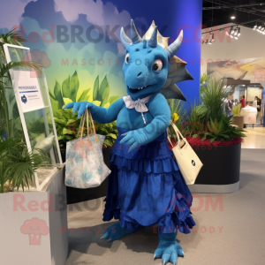 Blue Triceratops mascot costume character dressed with a Maxi Skirt and Tote bags