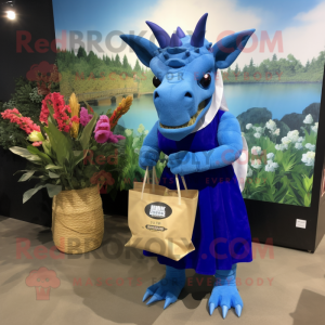 Blue Triceratops mascot costume character dressed with a Maxi Skirt and Tote bags