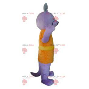 Mascotte lupo viola vestito con un costume arancione -