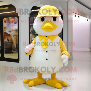 Cream Canary mascot costume character dressed with a Dress Pants and Beanies