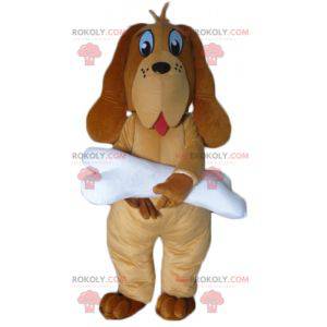 Mascota perro marrón con un hueso blanco gigante -