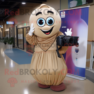 Tan Camera mascot costume character dressed with a Ball Gown and Backpacks