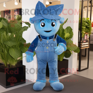 Sky Blue Spinach mascot costume character dressed with a Dungarees and Brooches