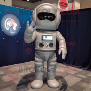 Gray Astronaut mascot costume character dressed with a One-Piece Swimsuit and Reading glasses