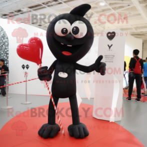 Black Arrow Of Love mascot costume character dressed with a Skinny Jeans and Shoe laces