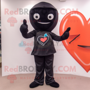 Black Arrow Of Love mascot costume character dressed with a Skinny Jeans and Shoe laces