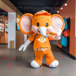 Orange Elephant mascot costume character dressed with a Graphic Tee and Backpacks