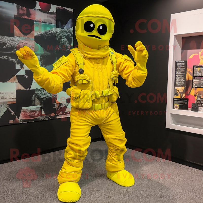 Yellow Para Commando mascot costume character dressed with a Playsuit and Foot pads