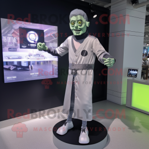 Silver Frankenstein mascot costume character dressed with a Cardigan and Smartwatches