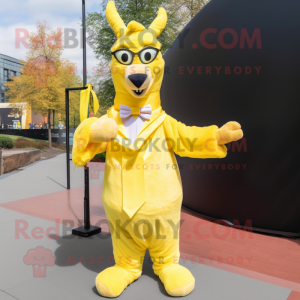 Yellow Llama mascot costume character dressed with a Cover-up and Bow ties