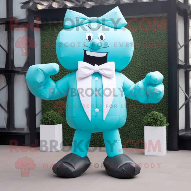 Cyan Strongman mascot costume character dressed with a Suit and Bow ties