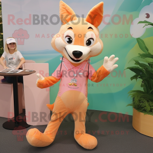 Peach Dingo mascot costume character dressed with a Romper and Hairpins