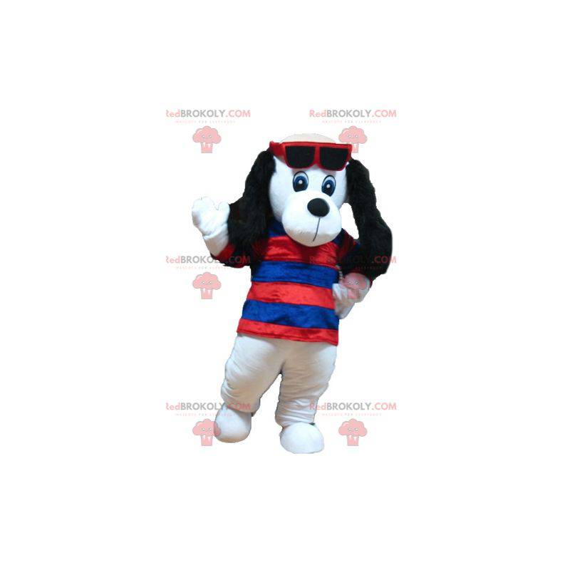 Mascote cachorro branco e preto com um suéter listrado -