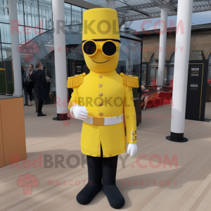 Yellow British Royal Guard mascot costume character dressed with a Sweater and Sunglasses