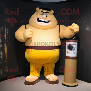 Gold Strongman maskot...