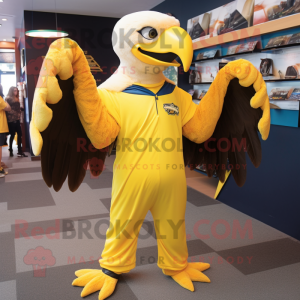 Yellow Bald Eagle mascot costume character dressed with a Jumpsuit and Shawl pins