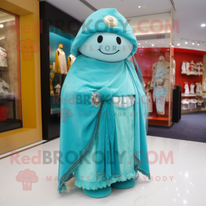 Turquoise Dim Sum mascot costume character dressed with a T-Shirt and Shawl pins