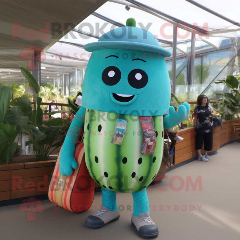 Turquoise Watermelon mascot costume character dressed with a Dungarees and Messenger bags