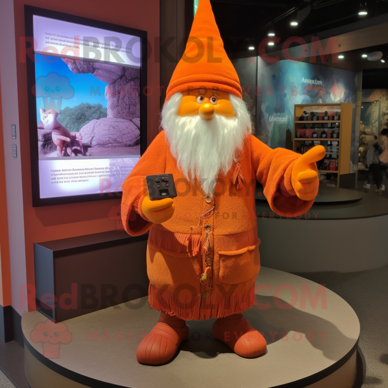 Orange Wizard mascot costume character dressed with a Sweatshirt and Mittens Orange Wizard mascot costume character dressed with a Sweatshirt and Mittens