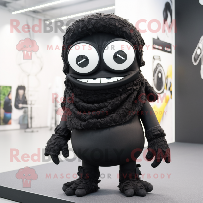 Black Cyclops mascot costume character dressed with a Blouse and Scarf clips Black Cyclops mascot costume character dressed with a Blouse and Scarf clips