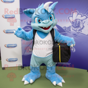 Sky Blue Chupacabra mascot costume character dressed with a Bermuda Shorts and Messenger bags