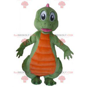 Mascotte di dinosauro verde arancione e rosa - Redbrokoly.com