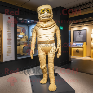 Gold Mummy mascot costume character dressed with a Bootcut Jeans and Suspenders