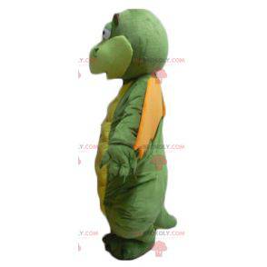 Funny looking green yellow and orange dragon mascot -