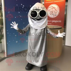 Silver Paella mascot costume character dressed with a Wrap Dress and Sunglasses