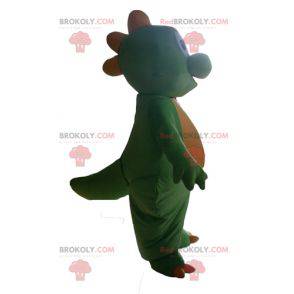 Cute and touching green and yellow dinosaur mascot -