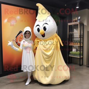 Cream Mango mascot costume character dressed with a A-Line Dress and Keychains