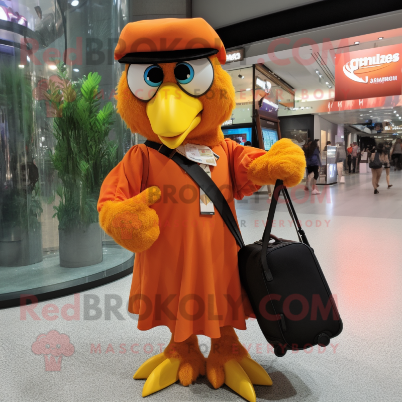 Orange Eagle mascot costume character dressed with a Maxi Dress and Messenger bags Orange Eagle mascot costume character dressed with a Maxi Dress and Messenger bags